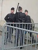 Some gendarmes mobiles equipped with shields, FAMAS and gas mask