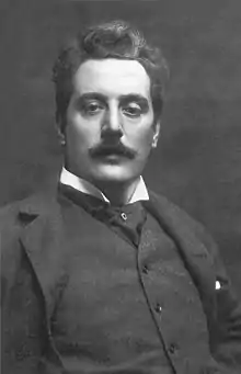 Black-and-white photograph of a young, moustachioed man.