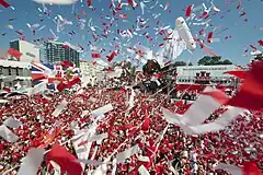 Image 21Thousands of Gibraltarians dress in their national colours of red and white and fill Grand Casemates Square during the 2013 Gibraltar National Day celebrations (from Culture of Gibraltar)