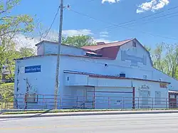 A photo of the exterior of an historic mill pictured in the daytime