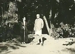 Geeta Sarabhai Mayor and her father, Ambalal Sarabhai, while out for a morning walk in the spacious grounds of their residential complex called "The Retreat", designed by Le Corbusier.