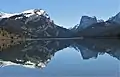 White Rock (left), Squaretop Mountain (right) reflected in Green River Lakes.White Rock is a dolomite and limestone cliff that rises 3,300 feet above the lake.