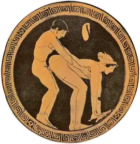 Image 10A prostitute and her customer illustrated on an ancient Greek wine cup; the act of prostitution is indicated by the coin purse above the figures. (from Prostitution)