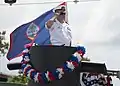 The commander of Submarine Squadron 15 at Naval Base Guam on a float in the 2019 Liberation Day parade