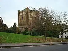 roofless stone castle keep in parkland