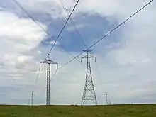 The only crossing of two different HVDC overhead powerlines in the Western hemisphere, CU ( small pylons) and Square Butte ( large pylons) in North Dakota