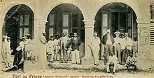 Image 14Staff of the German legation and the Hamburg-Amerika Line agency at Port-au-Prince, Haiti in 1900. The agency was involved in the staffing and management of the legation. German nationals were comparatively numerous in Haiti and heavily involved in the Haitian economy until World War I. (from History of Haiti)