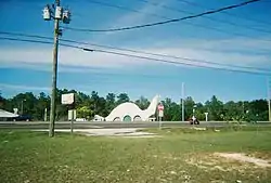 Harold's Garage on US 19 is a gas station shaped like a dinosaur, an example of novelty architecture.