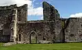 View from west, showing entrance to the refectory undercroft, the main storage area for provisions, and above it the west window of the refectory.