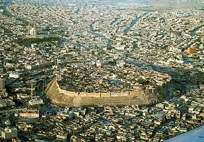 Aerial view of the Citadel of Erbil, surrounded by the modern city