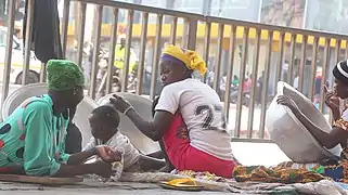 Ghanaian kayayei resting after work in Accra