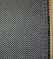 Example of the herringbone pattern, a popular choice for suits and outerwear