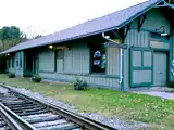 Rear view of Holland Patent Railroad Station, showing train tracks.