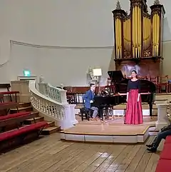 A singer and her accompanist competing in the final round of Bampton Classical Opera's Young Singers' Competition in December 2021 in the Holywell Music Room