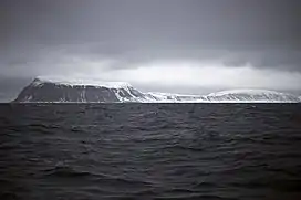 The southernmost point, Kapp Thor, and the highest point, Iversenfjellet (370 m) seen from south