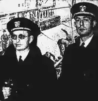 Two men in naval uniform