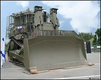 IDF Caterpillar D9.Armored bulldozers are standard combat engineering tools, as they can perform construction, destruction and EOD missions under heavy fire.