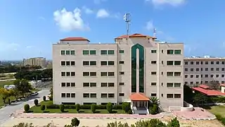 IUG Faculty of Medicine building is seen from the east.