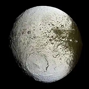 Image 23IapetusPhoto credit: Cassini orbiterFalse-color mosaic shows the entire hemisphere of Iapetus (1,468 km or 912 mi across) visible from the Cassini orbiter on the outbound leg of its encounter with the two-toned moon of Saturn in September 2007. The central longitude of the trailing hemisphere is 24 degrees to the left of the image's center. It is hypothesized that the moon's two-toned nature is due to the sublimation of various ices evaporated from the warmer parts of the surface.More selected pictures