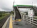 View of the other side platform, accessed from the station building by a footbridge.