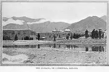 Early photograph of Jokhang behind a small body of water