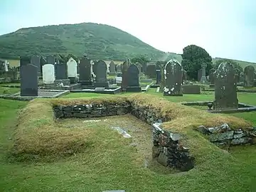 A primitive chapel dating from 6th to 11th centuries, at the cemetery of the church in the village named for Maughold.