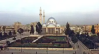 A religious building with multiple silver domes