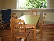 A wooden dining table and chairs