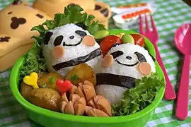 An oekakiben containing rice balls decorated to resemble pandas