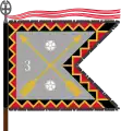 The traditional colour of the Kymi Jaeger Battalion, today a part of the Karelia Brigade, is of the form defined for light infantry. The Kymi Jaeger Battalion follows the traditions of the 3rd Bicycle Battalion and carries that number on its colour, and the Order of the Cross of Liberty both as a streamer and as the point of the staff.