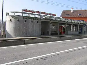 Concrete building with rounded side and flat roof