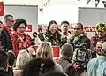 Prime Minister of New Zealand Jacinda Ardern and Pasifika Members of Parliament wear lei at an event.