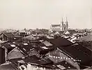 The Sacred Heart Cathedral towering over the one- and two-story homes of old Guangzhou c. 1880