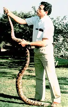 Lalji Singh holding a snake