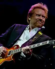 Singer Lee Roy Parnell playing an electric guitar.