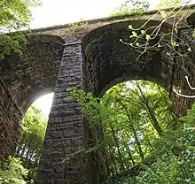 The overgrown viaduct across Lobb Ghyll on the Skipton to Ilkley Line in Yorkshire, built by the Midland Railway in 1888 and closed in 1965