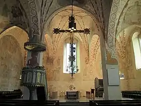 Interior view of Lohja Church showing the vivid medieval paintings executed in 1510s.