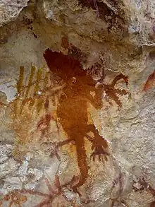 Ancient painting of lizard, one of the oldest cave paintings in Papua, Indonesia