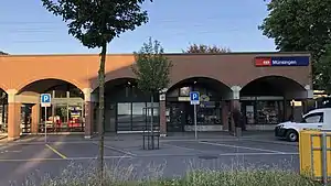 Single-story brick building with arched facade