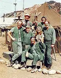 The cast of M*A*S*H from season 8 onward (clockwise from left): Mike Farrell, William Christopher, Jamie Farr, David Ogden Stiers, Loretta Swit, Alan Alda, and Harry Morgan