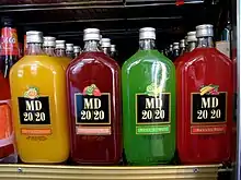 4 colorful MD 20/20 drink bottles on a shelf