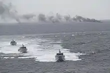 The hulk of the retired fast attack craft BRP Dionisio Ojeda (PC-117) burns after being hit by a Spike-ER missile launched from an MPAC Mk. III attack boat during a live fire demonstration held in November 2018 off the coast of Bataan.