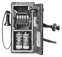 Image 261917 wall telephone, open to show magneto and local battery (from History of the telephone)