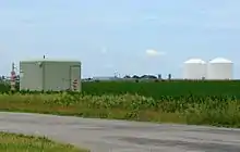 Image 28Peoples Gas Manlove Field natural gas storage area in Newcomb Township, Champaign County, Illinois. In the foreground (left) is one of the numerous wells for the underground storage area, with an LNG plant, and above-ground storage tanks are in the background (right). (from Natural gas)