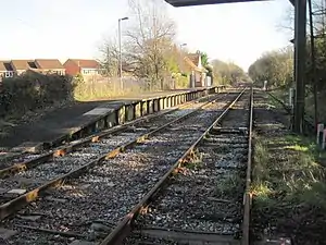 A short railway platform with two lines running past