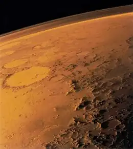 Mars appears to be red because of iron oxide on its surface.