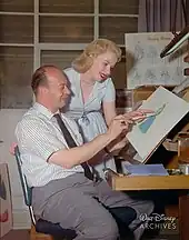 Marc Davis showing Mary Costa a drawing of Aurora