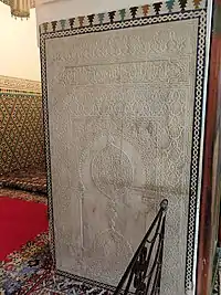 Saadian-era carved marble panel at the entrance to the tomb chamber