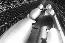 Six US Navy  blimps in one of the two hangars at MCAS Tustin, date unknown.