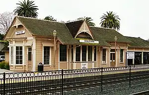 A pink railroad station building